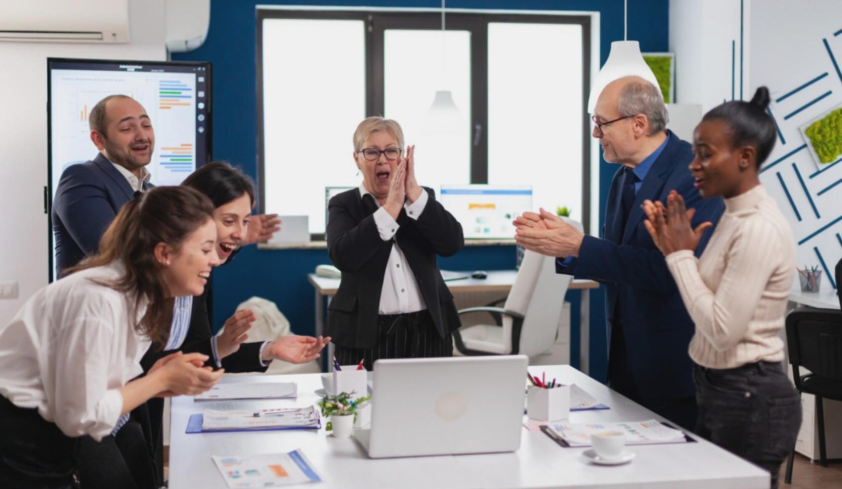 Financial professionals collaborating on modeling projects in a modern workspace